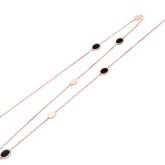 Sautoir en or rose et onyx