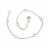 Bracelet souple or blanc parsemé de cinq diamants sertis clos