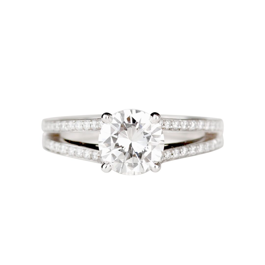 Solitaire diamant rond anneau double habillé de diamants